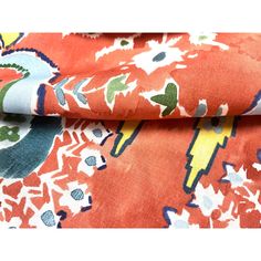 an orange and blue floral print fabric