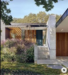 a house with wooden doors and brick walls