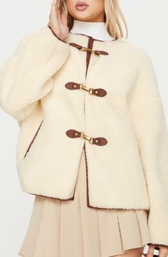 Faux shearling gives teddy-bear-inspired texture to this relaxed-fit coat with handy pockets to hold your essentials. Clasps at front Jewel neck Side-seam pockets Lined 100% polyester faux fur Hand wash, dry flat Imported Faux Shearling Coat, Festival Jacket, Fluffy Jacket, Fitted Coat, Stylish Coat, Teddy Coat, Sweatshirt Set, Fall Coat