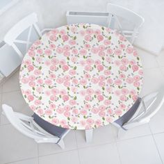 an overhead view of a table and chairs with pink flowers on it