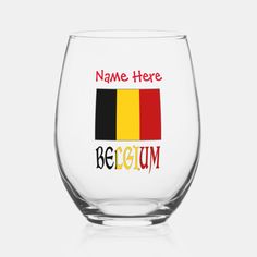 a wine glass with the words name here and belgium in red, black, yellow, and green