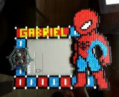 a spiderman photo frame made out of legos