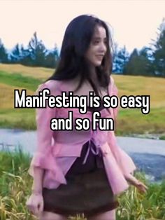 a woman in pink shirt and skirt standing on grass with text that reads, manifesting is so easy and so fun