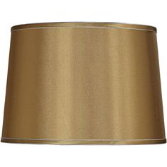 a gold lamp shade on a white background