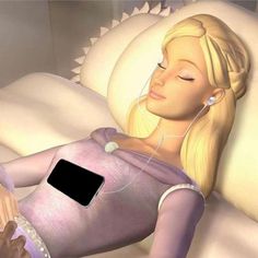 a woman laying in bed listening to music with headphones on her ears and an mp3 player attached to her ear