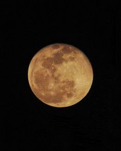 the full moon is seen in the dark sky