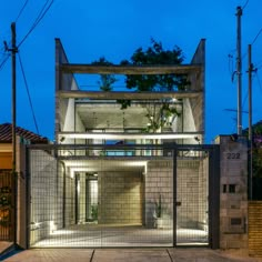 an entrance to a modern house at night