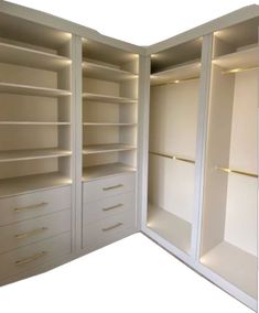 an open white closet with drawers and lights on the shelves in front of each other