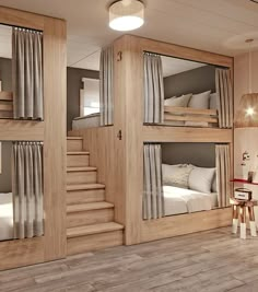 a room with bunk beds and stairs in it