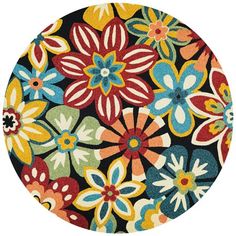 a round rug with colorful flowers on it