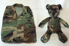 a teddy bear is sitting next to a camouflage shirt