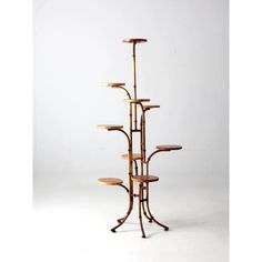 a tall wooden shelf with three tiers on it