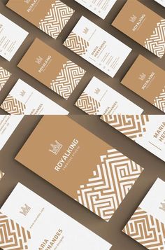 several business cards with brown and white designs on them, all lined up in rows