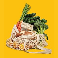 a bag full of vegetables sitting on top of a yellow background