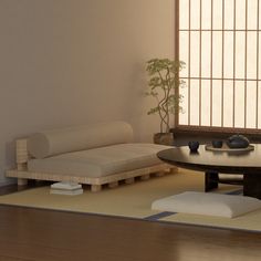 a living room with a couch, coffee table and potted plant in the corner