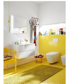 a bathroom with yellow flooring and white walls