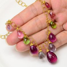 "DESCRIPTION: Thank you for coming in! A Spectacular necklace made of smooth tourmaline plain pear briolettes beads with mesmerizing charm and 18k solid yellow gold findings! The stones come in amazing fancy colors which can only be found in old mine Afghani material(including precious purple tourmaline), extremely rare transparency and hard-to-find big sizes! 19\" necklace, symmetrical arrangement on both sides with a 12.3mmx18mm focal bead! You'll get the necklace you see! SIZE: 6.2mmx8mm-12.3 Purple Tourmaline, Briolette Necklace, Yellow Gold Necklace, Antique Diamond, Focal Bead, Solid Yellow, Diamond Gemstone, Fire Opal, Stone Beads