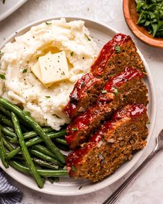 meatloaf, mashed potatoes and green beans on a plate