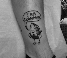 a man with a tattoo on his leg that says i am ironman and an ice cream cone