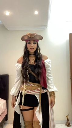 a woman dressed in pirate costume standing on the floor with her hands behind her back