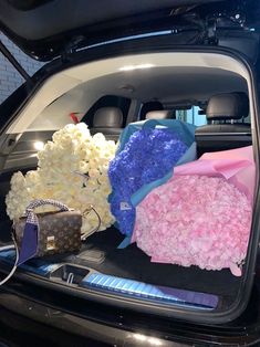 flowers are placed in the trunk of a car