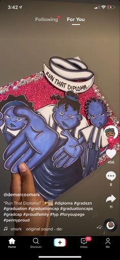 someone is holding up a sticker with an image of two blue cats on it