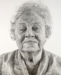 an old man with curly hair and eyes is shown in this black and white photo