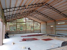 the inside of a building that is being built with wood and metal framing on the walls