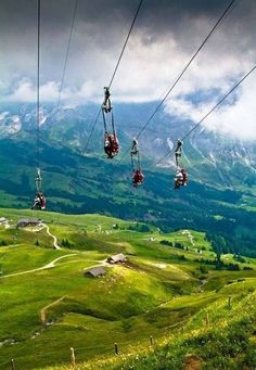 the words dream big are in front of an image of a mountain range and some people on a ski lift