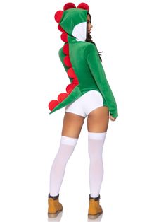 a woman in a costume that is wearing a green and red dragon suit with white stockings