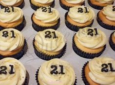 cupcakes with white frosting and black numbers on them