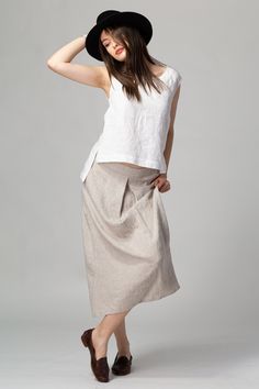 READY TO SHIP - Basic linen skirt, with a chic front box pleat that drapes beautifully down to a midi length. The subtle A-line silhouette creates a soft, relaxed and feminine look that is easily complimented by any top shape, fitted, relaxed or boxy. The concealed side pockets make it easy to wear with platforms, flat sandals and trainers. Made of quality stonewashed European linen, softened and wrinkled to perfection. FIT The Front Pleat Skirt has a relaxed fit and sits slightly below the wais Box Skirt, Skirt Linen, Box Pleat Skirt, Pleat Skirt, Style Finder, Skirt With Pockets, Linen Style, French Seam, Linen Skirt