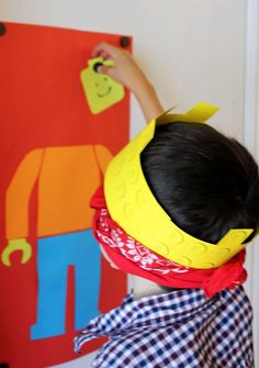 a young child is painting on the wall