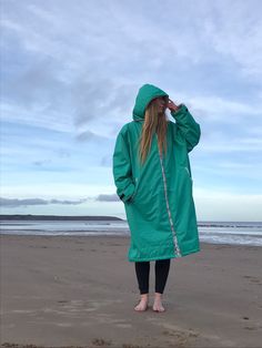 Our swell changing robe is waterproof, windproof and with a super soft sherpa fleece lining it will keep you snug after winter surfs and swims! Specifications: -fully lined in soft sherpa fleece lining -outer fabric is waterproof  -inside zip pocket to keep your valuables safe -adjustable velcro cuffs -front zip opening -large cosy hood with drawstring fastening -two side pockets -embroidered logo on the back and front -printed aztec trims  -anti-corrosion plastic zip -robe is 70cm wide when zip Blue Uv Protection Swimwear For Surfing, Beachy Stretch Swimming Cover-up, Green Surfing Swimwear With Upf 50+, Green Upf 50+ Surfing Swimwear, Surf Towel Poncho, Beach Poncho, Changing Robe, Style Expert, Zip Ups