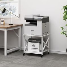 an office desk with a printer on it