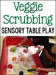 a child is playing with vegetables in a plastic tray and the words veggie scrubbing on it