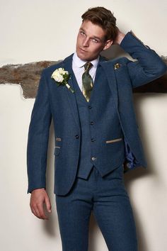 Wedding suit tick! Smart & timeless this men's and children's blue tweed suit is the ideal choice for heritage weddings. The Dion suit is made for grooms with its soft lapis blue tone and champagne trims. It has been created with meticulous craftsmanship using a herringbone weave and the added wool content lends a hand to durability and comfort. This heritage three piece will ensure all eyes are on you on the big day. Features Herringbone Slim fit Single-breasted Notch lapel Single back vent Fou Tweed Men, Suit Man, Blue Suit Wedding, Dinner Suit, Tweed Suit, Blue Tweed