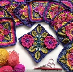 several crocheted squares with flowers on them