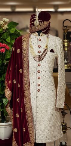 Step into elegance and tradition with our Marvellous White Sherwani, a stunning choice for the discerning groom. This designer sherwani blends classic charm with contemporary style, perfect for a memorable wedding day look. Handcrafted with meticulous attention to detail, this sherwani features intricate embroidery and exquisite embellishments, making it a standout piece for any groom. Elevate your wedding attire with this magnificent sherwani, tailored to perfection for a truly regal appearance on your special day. Please note: This is a made-to-measure product. Simply select your approximate chest size when placing your order. Once your order is received, we will contact you to schedule a video call for complete measurements. Cost Includes: Sherwani and Pajama(bottom) only. Accessories l Groom Indian Wedding Outfits Sherwani White, Groom Indian Wedding Outfits Sherwani, Sherwani For Men Wedding Indian Groom, Men Sherwani Wedding Indian Groom, Men Sherwani Wedding, Groom Indian Wedding Outfits, Groom Wedding Outfit, White Sherwani, Sherwani Wedding