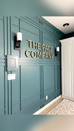 the page company is located on the wall in this office building's entryway