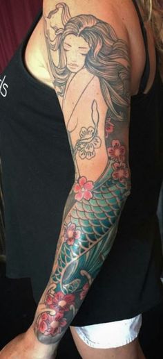 a woman with a tattoo on her arm