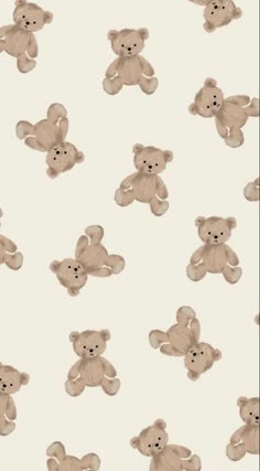 a group of teddy bears sitting next to each other on a white wallpaper background