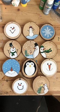 wooden slices with painted snowmen on them