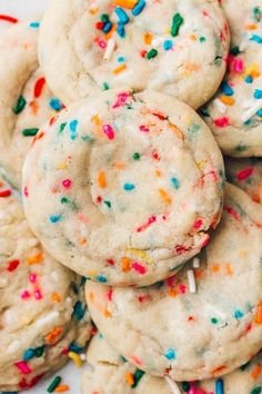 a pile of cookies with sprinkles on top