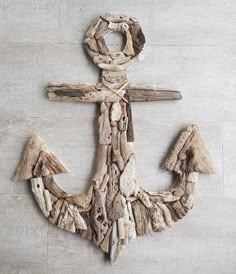 an anchor made out of driftwood on the floor