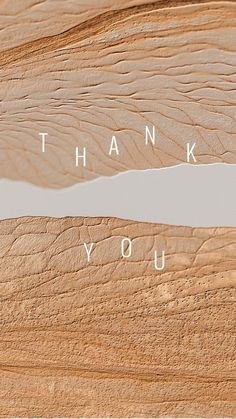 the words thank you written on wood are shown in white letters, and there is no image to describe