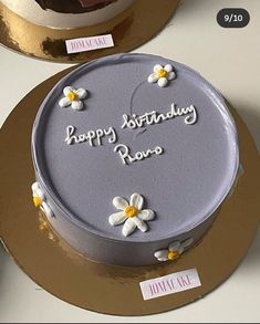 there is a birthday cake with flowers on it