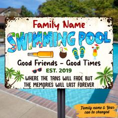 a swimming pool sign is shown in front of the pool