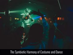 the silhouette of people at a dance with their arms in the air and lights on