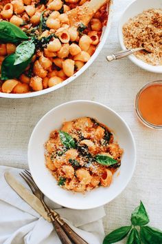 pasta with spinach and parmesan cheese served in bowls